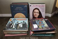 Stack of various classical and vocal LP records including Beethoven Symphony No. 9 and Nana Mouskouri