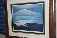 Framed Lawren Harris landscape print showing entire scene of cloud, water and shoreline