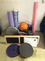 Photo of full set including the Extreme Balance Board, Sissel medicine ball, various foam rollers, balance discs, weights, posters and accessories.