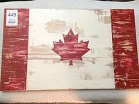 Front view of the wooden Canadian flag sign showing full flag design with distressed paint effect