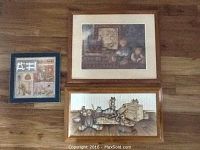 Photo of three framed teddy bear prints arranged on the floor showing their varying sizes and designs.
