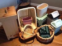 Photo showing collection of wooden waste bin, two stepping stools, four plastic waste baskets, laundry bin, and assorted wicker baskets.