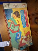 Photo of vintage Battleship game box top showing artwork and branding