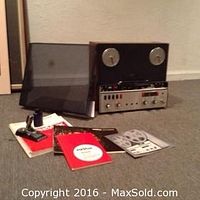 All items displayed together: tape recorder, dust cover, manuals, brochure and splicer