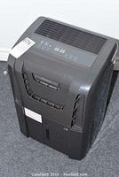 Full view of the black Danby DDR3011 dehumidifier showing front and top control panel.