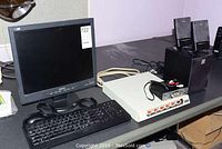 Phillips 170S monitor with keyboard, mouse, Curtis controller box, and Labtec speakers on a table.