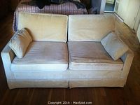 Front view of sand-colored velour loveseat with two seat cushions and two back cushions. Shows general condition and style.