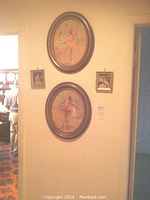 Wall showing two oval framed ballerina prints in pastel colors signed Fried and two small square Italian pictures.