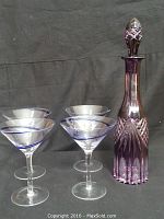 Full set with purple decanter and four martini glasses showing complete lot.