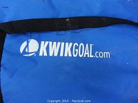 Close-up of the KwikGoal logo on the blue fabric of the bench.