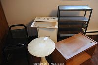 Shows marble plant stand, filing cabinet, glass top, black metal TV stands