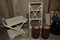 View of the garden cart on the left, wooden display ladder in the middle, two wooden barrels on right, with framed picture partially visible to the side