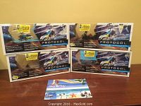 Four boxed Protocol TraceJet remote control helicopters stacked on a table, showing the packaging and branding.