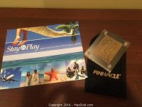Plaque and Stay & Play brochure on tabletop