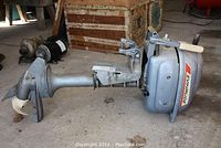 Side view showing full length of motor, propeller, shaft, mounting bracket and fuel tank.