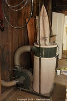 Overall view of entire dust collection unit with filter bag, lower bag, and hoses