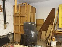 Stacked full-size cherry wood sheets at rear with smoke-tinted plexiglass panels leaning in front