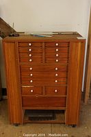 Front view of entire cabinet showing drawer layout and overall appearance