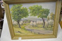 Frontal view of the framed acrylic painting showing the rural landscape with road, trees, and houses.
