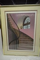 Framed print showing curved staircase and arched window with potted plant in muted pastel colors.