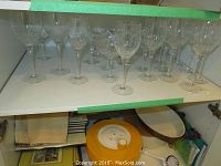 Full set of crystal stemware on shelf