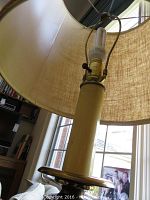 Close-up of lamp socket, pole, and fibreglass shade, showing lamp structure and materials