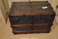 Front exterior view showing overall shape, wood slats and central lock plate