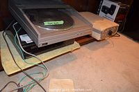 Centrios turntable, speaker, and foot massager visible with power cords and control panel on massager