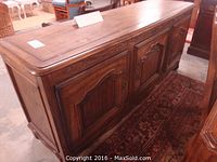 Full view of walnut sideboard showing overall structure and doors.