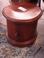 Closed top view of round wooden cabinet