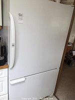 Exterior front view of closed refrigerator and freezer doors