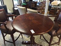 Table and two chairs positioned in showroom
