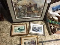Four framed prints on carpet including large 'Sunshine Valley Mill' and three smaller prints 'Peggy's Cove,' 'Sundown Otter Lake,' and 'Bellrock Mill'