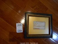 Overview of small framed watercolour with label showing approximate dimensions 5x3 inches.