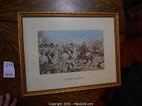 Image of framed print showing cavalry soldiers of the 8th King's Royal Light Dragoons in battle at Laswarree, with gold frame and matting.