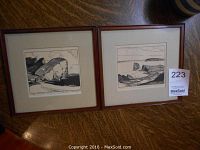 Two framed black-and-white prints side by side on wooden surface, labeled 223