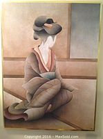 Front view of the framed fabric and suede picture showing the stylized geisha girl