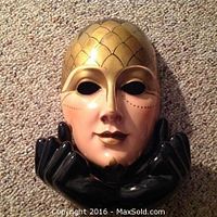 Front close-up of the ceramic Venetian clown mask with gold and black detailing