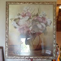 Framed floral painting showing pink and white flowers in a vase with ornate gold frame.