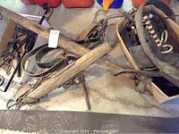 Full view of oxen yoke and surrounding tools showing item condition and contents of lot