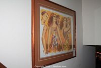 Full view of framed lithograph hanging on wall