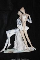 Front view of entire figurine showing both harlequin and ballerina figures on base