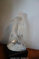 Front view of frosted glass figurine showing both dancers and base