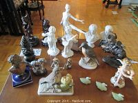 Overview of all miniature figurines and busts arranged on table