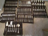Overview of flatware trays showing forks, knives and spoons