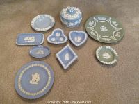 Full lot of 10 Wedgwood jasperware pieces including variety of blue and green plates, dishes, and lidded box.