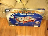 Box of Franklin Pro Action Rod Hockey Tabletop Game showing front with product image, branding, and game size (31.5 x 20 inches).