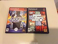 Photo showing 007 Agent Under Fire and Grand Theft Auto III GP PlayStation 2 game cases