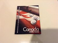 Front cover of the Millennium 25 Cent Dollar coin booklet for Canada 1999/2000 featuring Canadian flag and coin images.