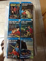 Photo of Hardy Boys books numbered 1 to 6 showing front covers with illustrated mystery scenes and titles.